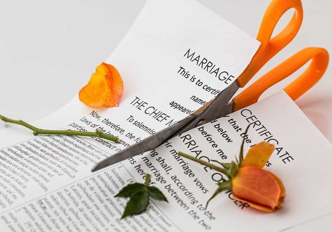 scissors cutting marriage document