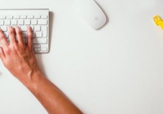 hands on a computer keyboard